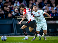 Feyenoord Rotterdam defender Hugo Bueno and FC Twente defender Bart van Rooij play during the match between Feyenoord and Twente at the Feye...