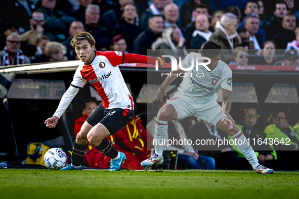 Feyenoord Rotterdam forward Ayase Ueda and FC Twente defender Mees Hilgers play during the match between Feyenoord and Twente at the Feyenoo...