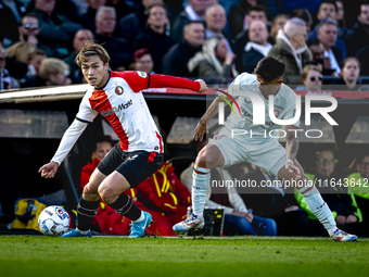 Feyenoord Rotterdam forward Ayase Ueda and FC Twente defender Mees Hilgers play during the match between Feyenoord and Twente at the Feyenoo...