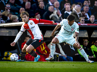 Feyenoord Rotterdam forward Ayase Ueda and FC Twente defender Mees Hilgers play during the match between Feyenoord and Twente at the Feyenoo...