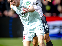 FC Twente forward Daan Rots and Feyenoord Rotterdam defender Hugo Bueno play during the match between Feyenoord and Twente at the Feyenoord...