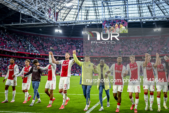 AFC Ajax Amsterdam forwards Chuba Akpom, Mika Godts, Wout Weghorst, defenders Jorrel Hato, Youri Baas, and forward Christian Rasmussen celeb...