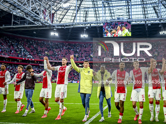 AFC Ajax Amsterdam forwards Chuba Akpom, Mika Godts, Wout Weghorst, defenders Jorrel Hato, Youri Baas, and forward Christian Rasmussen celeb...