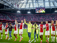 AFC Ajax Amsterdam forwards Chuba Akpom, Mika Godts, Wout Weghorst, defenders Jorrel Hato, Youri Baas, and forward Christian Rasmussen celeb...