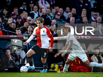 Feyenoord Rotterdam forward Ayase Ueda and FC Twente defender Mees Hilgers play during the match between Feyenoord and Twente at the Feyenoo...