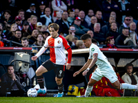 Feyenoord Rotterdam forward Ayase Ueda and FC Twente defender Mees Hilgers play during the match between Feyenoord and Twente at the Feyenoo...