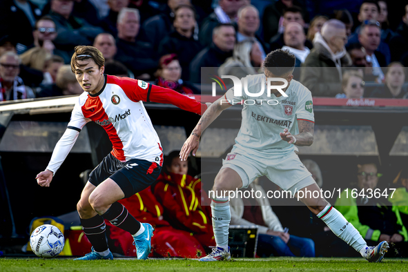 Feyenoord Rotterdam forward Ayase Ueda and FC Twente defender Mees Hilgers play during the match between Feyenoord and Twente at the Feyenoo...