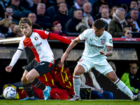 Feyenoord Rotterdam forward Ayase Ueda and FC Twente defender Mees Hilgers play during the match between Feyenoord and Twente at the Feyenoo...