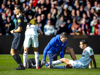 FC Twente defender Anass Salah-Eddine gets injured during the match between Feyenoord and Twente at the Feyenoord stadium De Kuip for the Du...