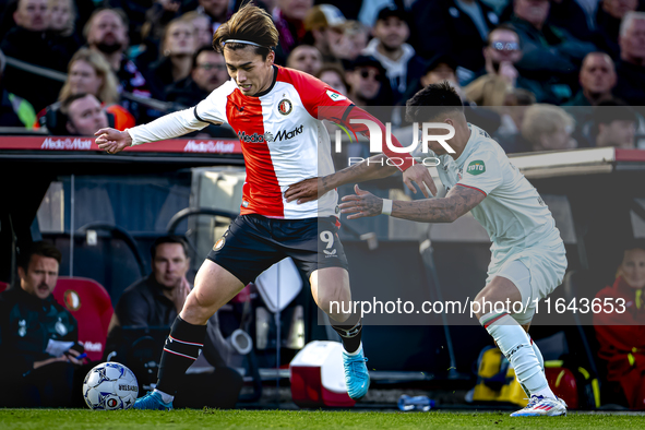 Feyenoord Rotterdam forward Ayase Ueda and FC Twente defender Mees Hilgers play during the match between Feyenoord and Twente at the Feyenoo...