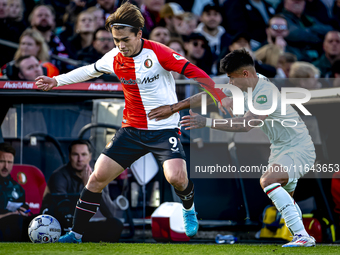 Feyenoord Rotterdam forward Ayase Ueda and FC Twente defender Mees Hilgers play during the match between Feyenoord and Twente at the Feyenoo...