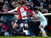 Feyenoord Rotterdam forward Ayase Ueda and FC Twente defender Mees Hilgers play during the match between Feyenoord and Twente at the Feyenoo...