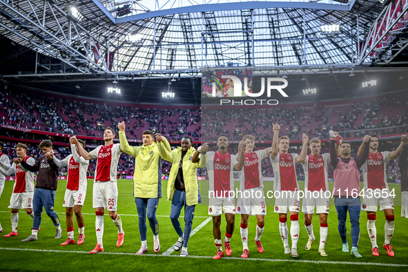 AFC Ajax Amsterdam forwards Chuba Akpom, Mika Godts, Wout Weghorst, defenders Jorrel Hato, Youri Baas, and forward Christian Rasmussen celeb...