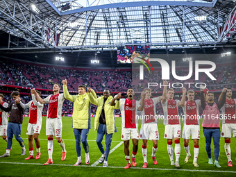 AFC Ajax Amsterdam forwards Chuba Akpom, Mika Godts, Wout Weghorst, defenders Jorrel Hato, Youri Baas, and forward Christian Rasmussen celeb...