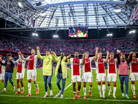 AFC Ajax Amsterdam forwards Chuba Akpom, Mika Godts, Wout Weghorst, defenders Jorrel Hato, Youri Baas, and forward Christian Rasmussen celeb...