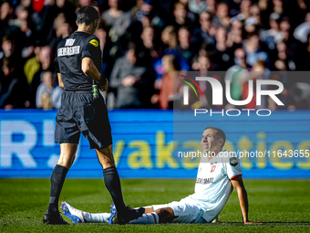 FC Twente defender Anass Salah-Eddine gets injured during the match between Feyenoord and Twente at the Feyenoord stadium De Kuip for the Du...