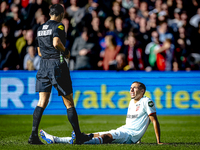 FC Twente defender Anass Salah-Eddine gets injured during the match between Feyenoord and Twente at the Feyenoord stadium De Kuip for the Du...