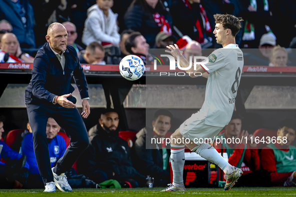 FC Twente trainer Joseph Oosting and FC Twente midfielder Youri Regeer participate in the match between Feyenoord and Twente at the Feyenoor...