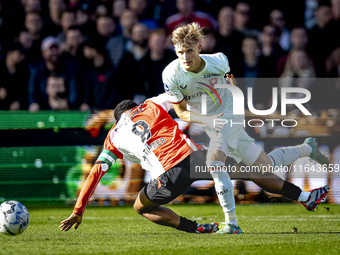 Feyenoord Rotterdam midfielder Quinten Timber and FC Twente defender Max Bruns play during the match between Feyenoord and Twente at the Fey...