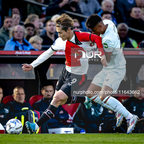 Feyenoord Rotterdam forward Ayase Ueda and FC Twente defender Mees Hilgers play during the match between Feyenoord and Twente at the Feyenoo...