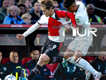 Feyenoord Rotterdam forward Ayase Ueda and FC Twente defender Mees Hilgers play during the match between Feyenoord and Twente at the Feyenoo...