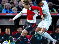 Feyenoord Rotterdam forward Ayase Ueda and FC Twente defender Mees Hilgers play during the match between Feyenoord and Twente at the Feyenoo...