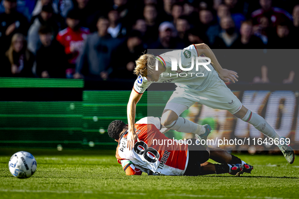 Feyenoord Rotterdam midfielder Quinten Timber and FC Twente defender Max Bruns play during the match between Feyenoord and Twente at the Fey...