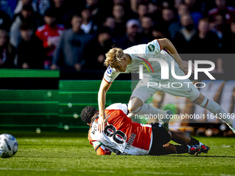 Feyenoord Rotterdam midfielder Quinten Timber and FC Twente defender Max Bruns play during the match between Feyenoord and Twente at the Fey...