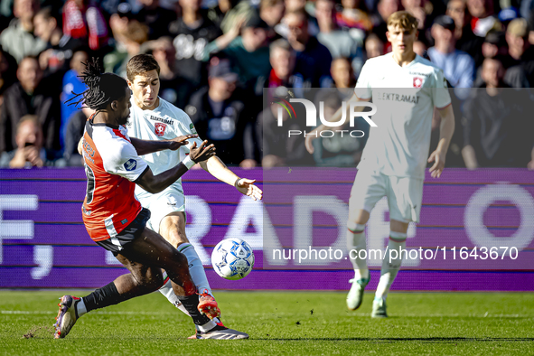 FC Twente midfielder Carel Eiting and Feyenoord Rotterdam defender Jordan Lotomba play during the match between Feyenoord and Twente at the...