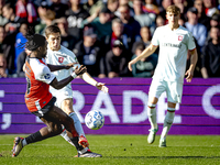 FC Twente midfielder Carel Eiting and Feyenoord Rotterdam defender Jordan Lotomba play during the match between Feyenoord and Twente at the...