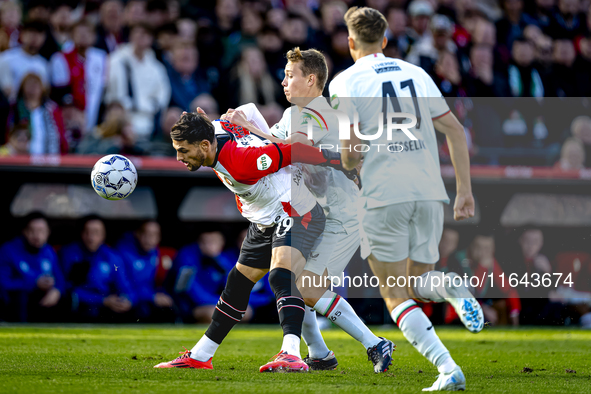 Feyenoord Rotterdam forward Santiago Gimenez and FC Twente midfielder Mathias Kjolo play during the match between Feyenoord and Twente at th...