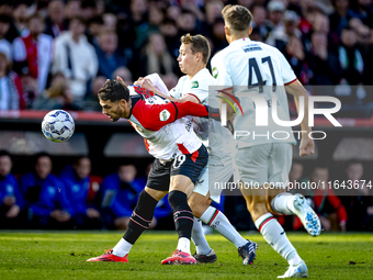 Feyenoord Rotterdam forward Santiago Gimenez and FC Twente midfielder Mathias Kjolo play during the match between Feyenoord and Twente at th...