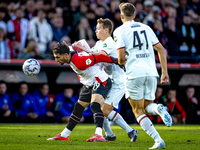 Feyenoord Rotterdam forward Santiago Gimenez and FC Twente midfielder Mathias Kjolo play during the match between Feyenoord and Twente at th...