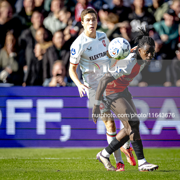 FC Twente midfielder Carel Eiting and Feyenoord Rotterdam defender Jordan Lotomba play during the match between Feyenoord and Twente at the...