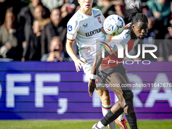 FC Twente midfielder Carel Eiting and Feyenoord Rotterdam defender Jordan Lotomba play during the match between Feyenoord and Twente at the...