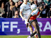 FC Twente midfielder Carel Eiting and Feyenoord Rotterdam defender Jordan Lotomba play during the match between Feyenoord and Twente at the...