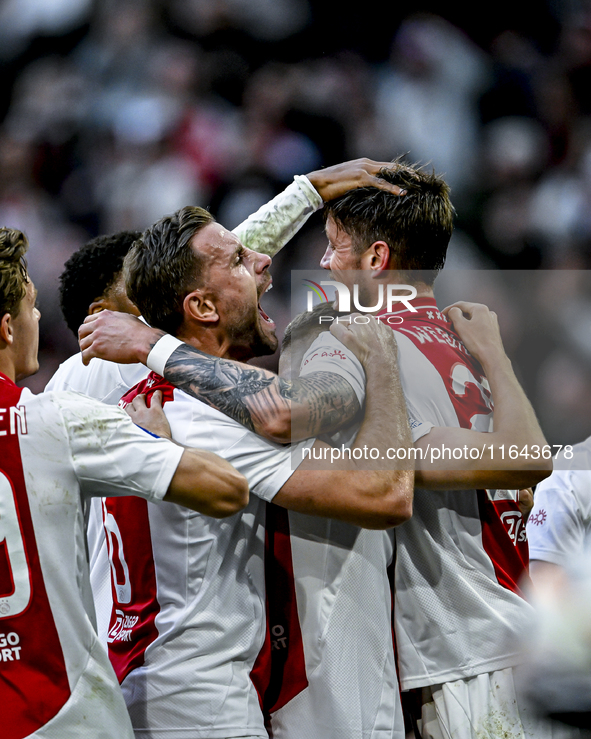 AFC Ajax Amsterdam forward Wout Weghorst and AFC Ajax Amsterdam midfielder Jordan Henderson celebrate the 2-1 goal during the match between...