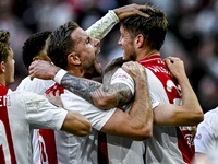 AFC Ajax Amsterdam forward Wout Weghorst and AFC Ajax Amsterdam midfielder Jordan Henderson celebrate the 2-1 goal during the match between...