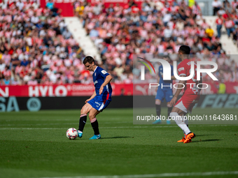 Players are in action during the LaLiga EA Sports match between Girona FC and Athletic Club de Bilbao at Montilivi Stadium in Girona, Spain,...