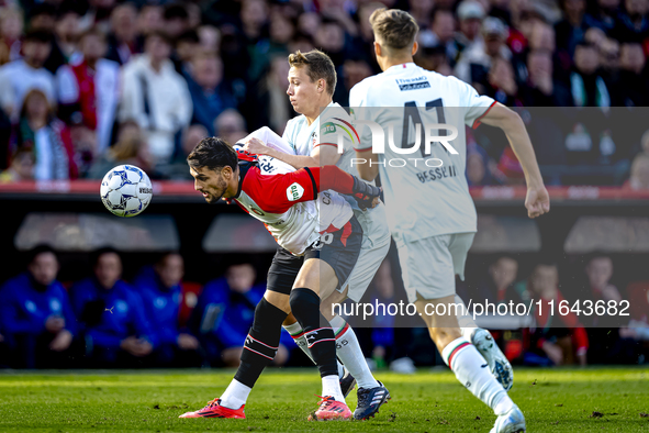 Feyenoord Rotterdam forward Santiago Gimenez and FC Twente midfielder Mathias Kjolo play during the match between Feyenoord and Twente at th...