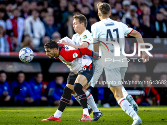 Feyenoord Rotterdam forward Santiago Gimenez and FC Twente midfielder Mathias Kjolo play during the match between Feyenoord and Twente at th...