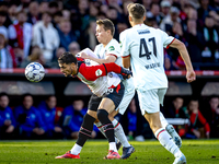 Feyenoord Rotterdam forward Santiago Gimenez and FC Twente midfielder Mathias Kjolo play during the match between Feyenoord and Twente at th...