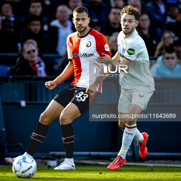 Feyenoord Rotterdam defender David Hancko and FC Twente forward Mitchell van Bergen play during the match between Feyenoord and Twente at th...