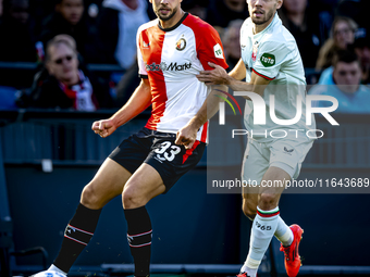 Feyenoord Rotterdam defender David Hancko and FC Twente forward Mitchell van Bergen play during the match between Feyenoord and Twente at th...