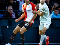 Feyenoord Rotterdam defender David Hancko and FC Twente forward Mitchell van Bergen play during the match between Feyenoord and Twente at th...