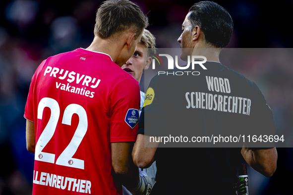 Referee Serdar Gozubuyuk and Feyenoord Rotterdam goalkeeper Timon Wellenreuther are present during the match between Feyenoord and Twente at...