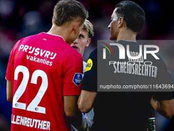 Referee Serdar Gozubuyuk and Feyenoord Rotterdam goalkeeper Timon Wellenreuther are present during the match between Feyenoord and Twente at...