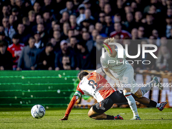 Feyenoord Rotterdam midfielder Quinten Timber and FC Twente defender Max Bruns play during the match between Feyenoord and Twente at the Fey...