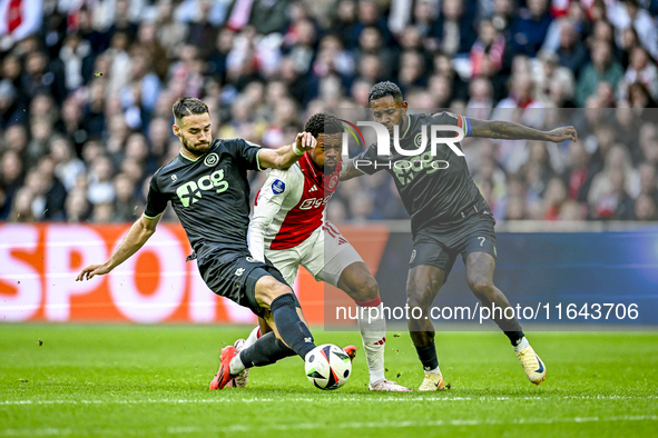 FC Groningen defender Marco Rente, AFC Ajax Amsterdam forward Chuba Akpom, and FC Groningen defender Leandro Bacuna participate during the m...