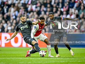 FC Groningen defender Marco Rente, AFC Ajax Amsterdam forward Chuba Akpom, and FC Groningen defender Leandro Bacuna participate during the m...